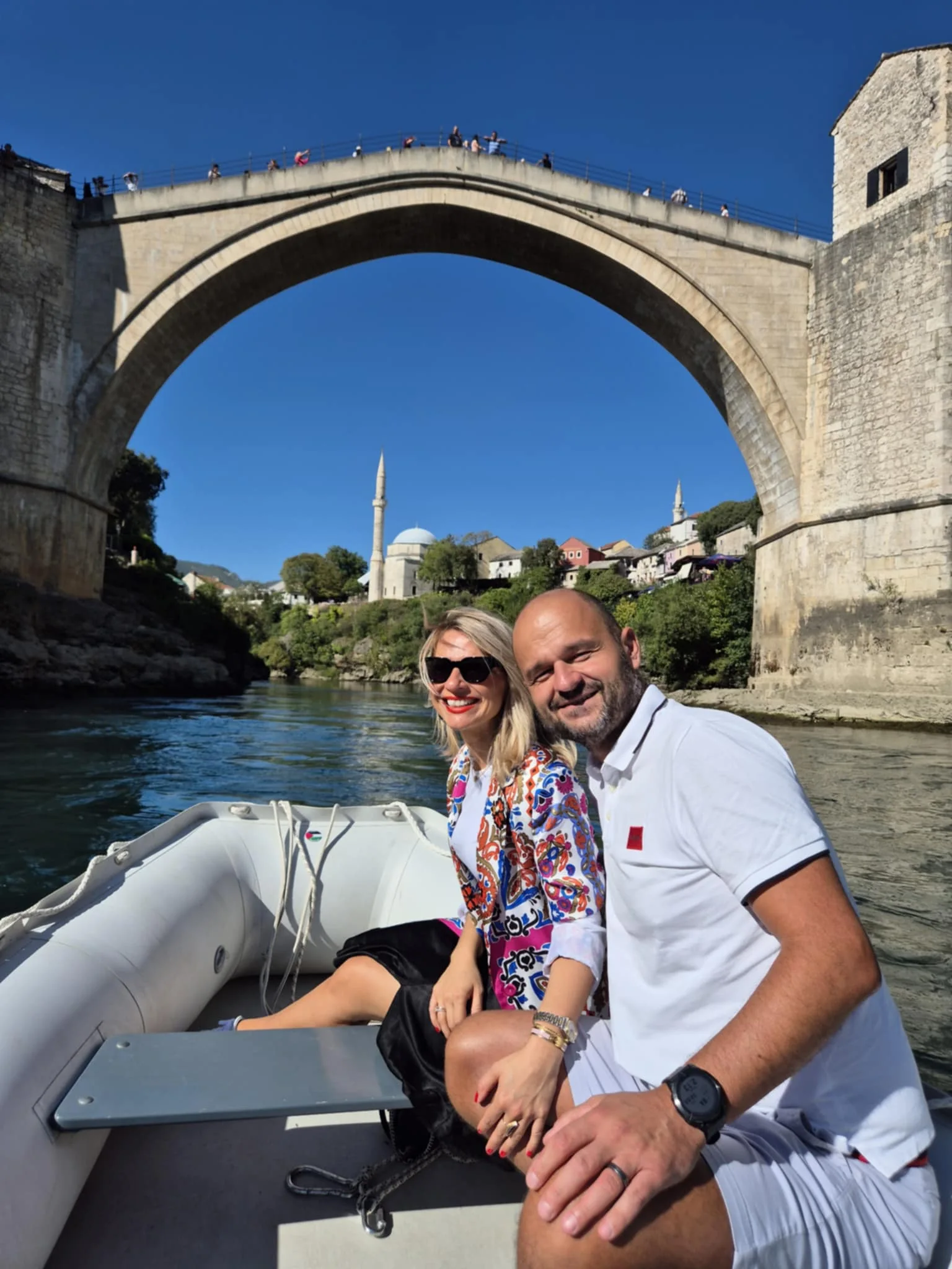 Arman and Ajla Asović on a boat trip beneath the Stari Most bridge in Mostar