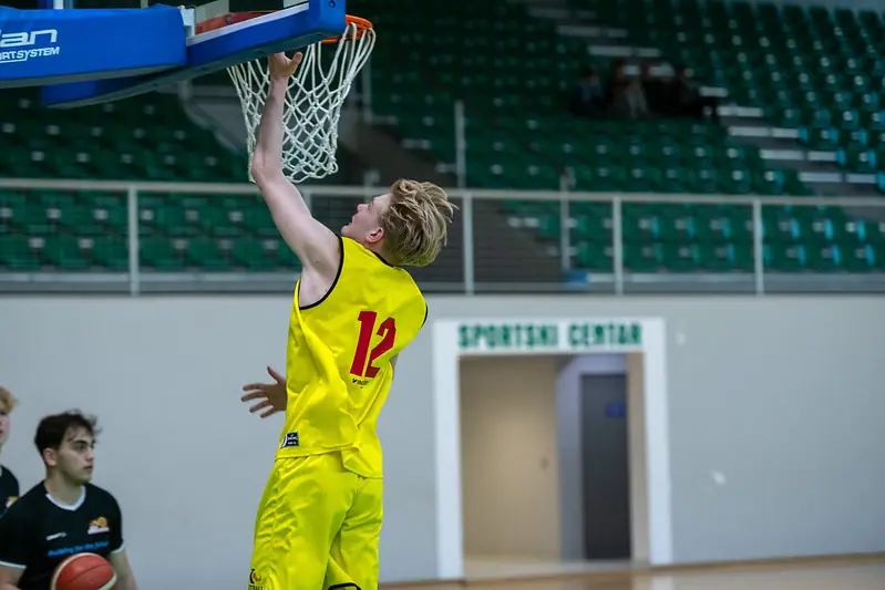 A player scoring during a basketball match
